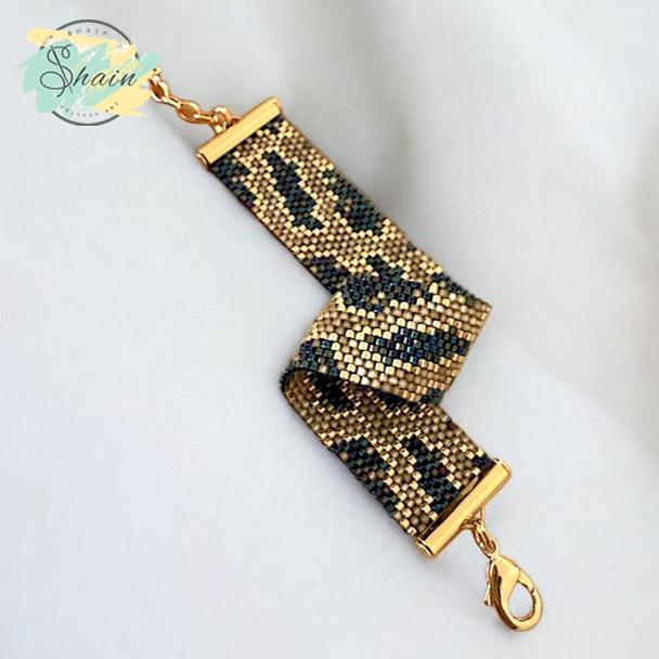 دستبند زنانه با طرح پوست مار، منجق میوکی و استیل ضد حساسیت، ظریف و مناسب هدیه از شاین گالری