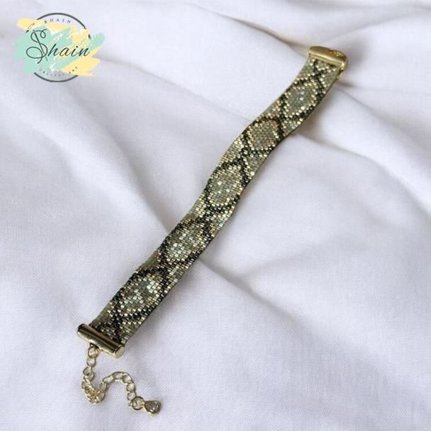 دستبند دستساز میوکی مدل پوست ماری با طراحی خاص و بافت منظم مناسب هدیه دادن و تکمیل استایلهای مینیمال شاین گالری