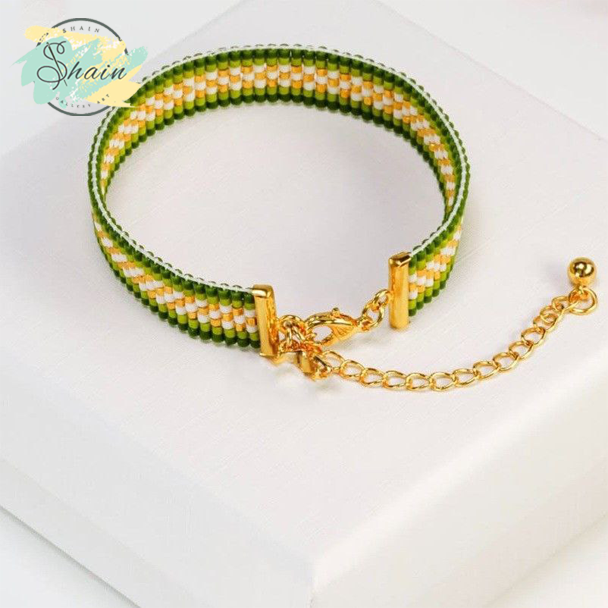 زیورآلات دستساز شاین گالری مدل میوکی حاشیه سبز با طراحی شیک، مهرههای ژاپنی اصل و دوام عالی برای استایلهای مختلف.