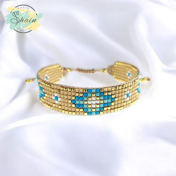 عکس دستبند میوکی آبی طلایی طرح لوزی کد 3066 مناسب استایلهای روزمره و مجلسی، ساخته شده با دقت و کیفیت عالی.