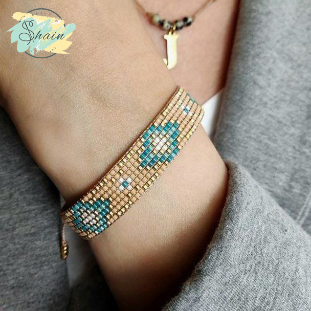 تصویر دستبند دستساز میوکی با طرح لوزی آبی طلایی کد 3066، محصولی شیک و زیبا از شاین گالری.